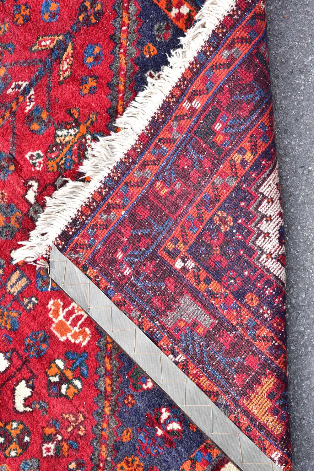 A red ground wool rug with central geometric pattern, 209 x 138cm. - Image 3 of 3