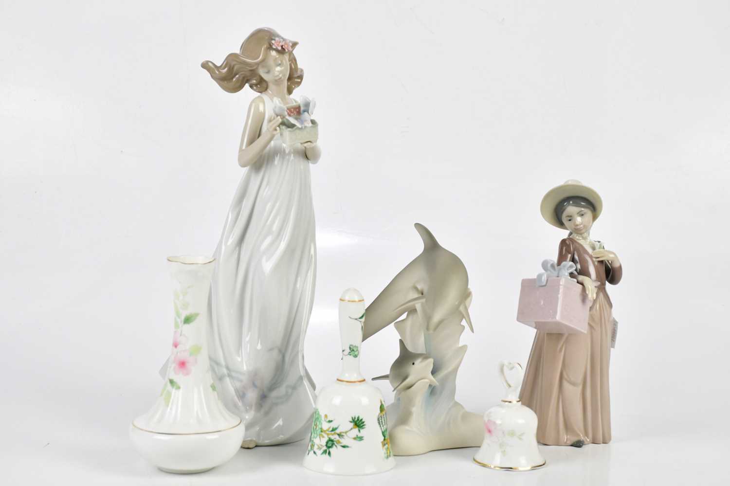 A small collection of ceramics including two Lladrό figures, a Staffordshire 'Kowloon' bell, two