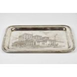A sterling silver rectangular tray with engraved decoration of the N.G.R School House America,