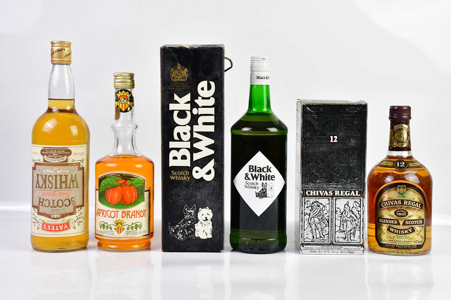 MIXED SPIRITS; a bottle of Chivas Regal 12 years old, Black & White Scotch whisky, Yates's Finest