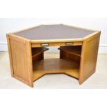 A modern oak corner desk with brown leather top and single drawer, height 76cm, depth 91cm, width