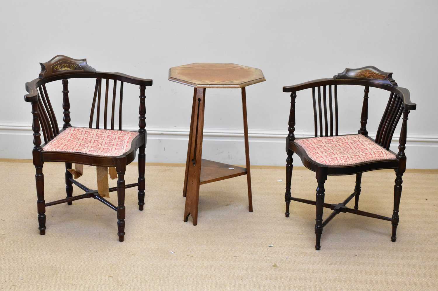 A pair of Edwardian inlaid mahogany corner chairs on turned column legs and an oak Arts and Crafts