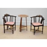 A pair of Edwardian inlaid mahogany corner chairs on turned column legs and an oak Arts and Crafts