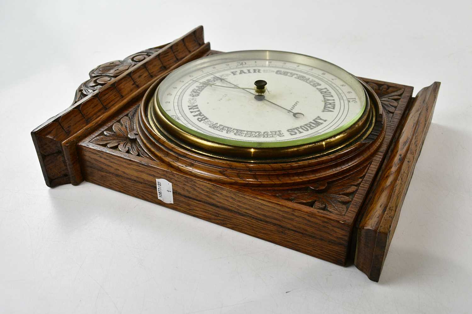 An early 20th century carved oak aneroid barometer, dial signed 'Bradford', 37 x 30cm. - Image 2 of 3