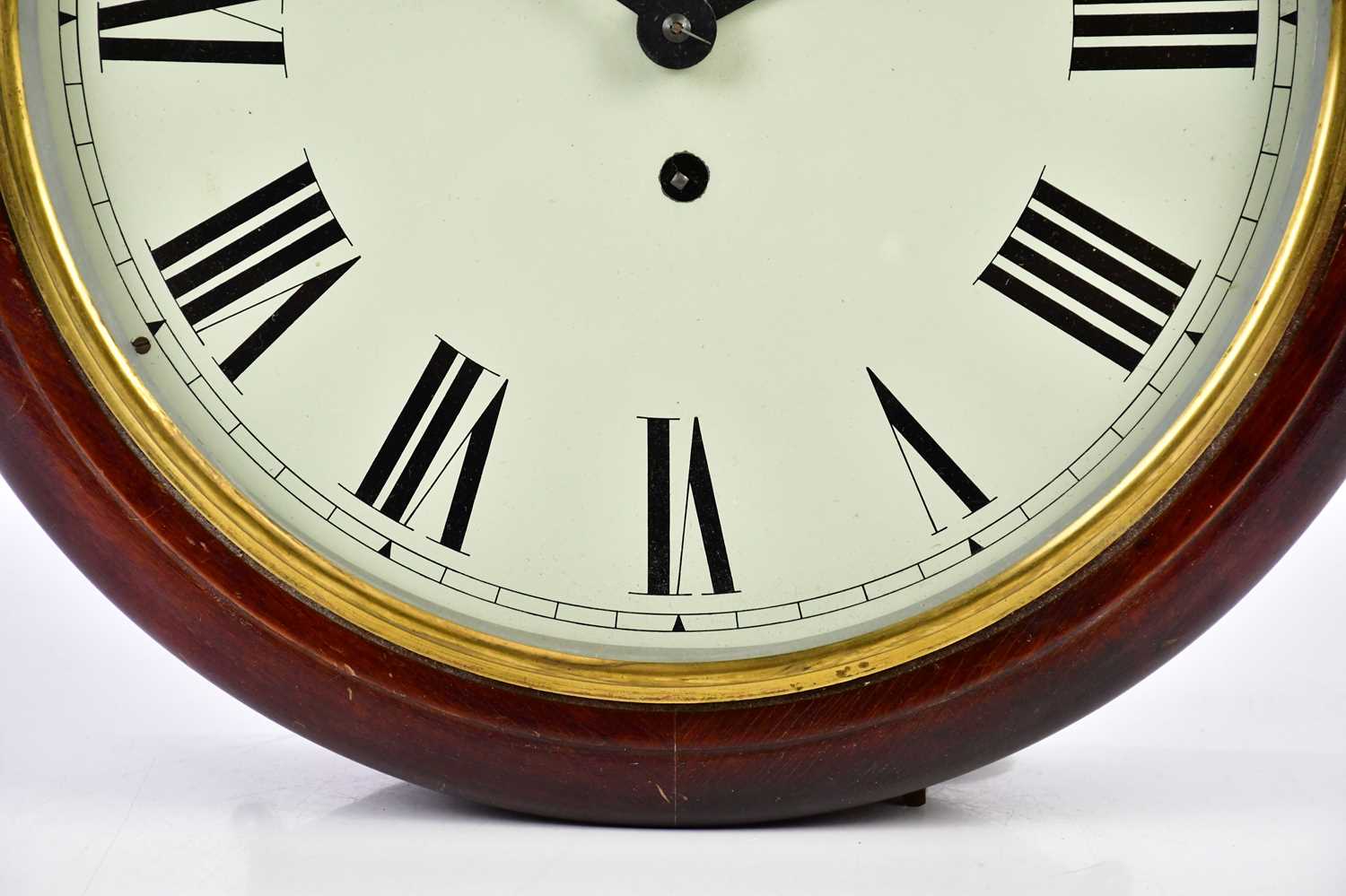 A mahogany cased station clock, the white dial set with Roman numerals, diameter 39cm. - Image 3 of 3