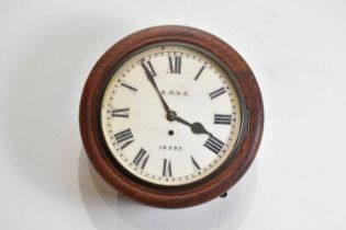 An early 20th century oak cased wall clock with fusee movement, the dial set with Roman numerals,