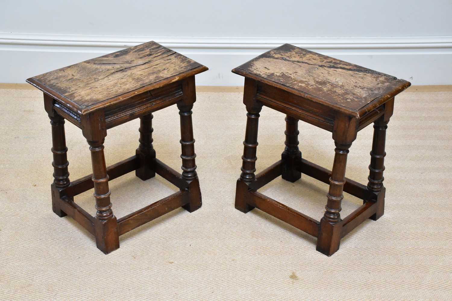 A pair of 18th century style oak joint stools, height 50cm, width 46cm.