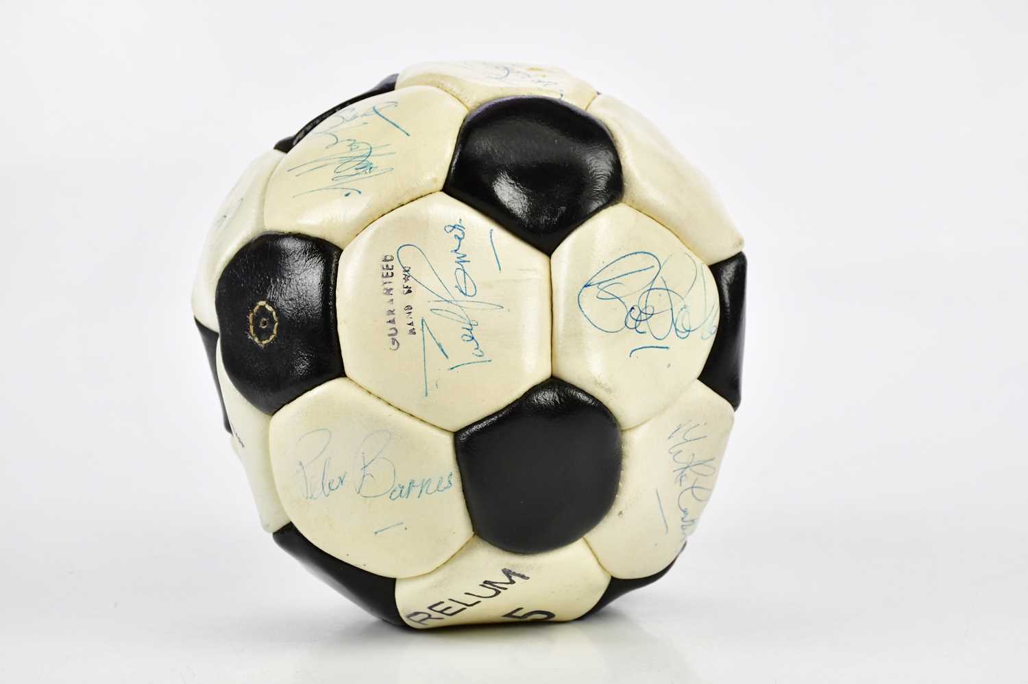 A signed football bearing various signatures including Pete Barnes.