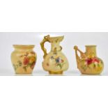 ROYAL WORCESTER; three pieces of blush ivory including a ewer with tree effect handle, numbered