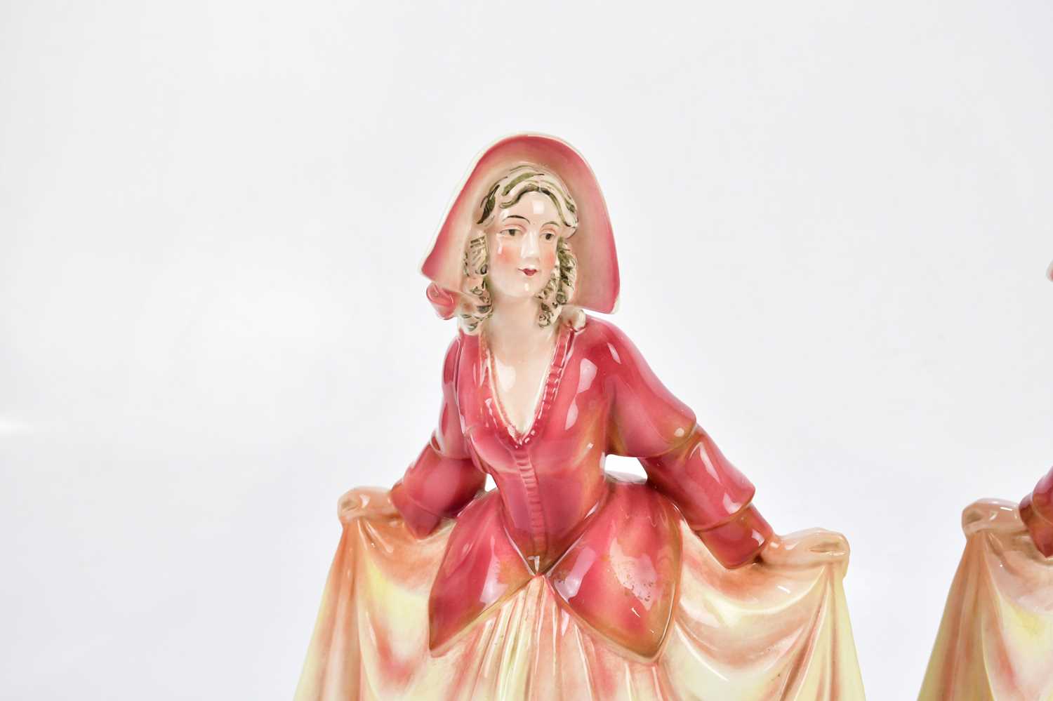 KATZHUTTE; two Art Deco ceramic figures depicting a maiden wearing a bonnet with flowing dress, - Image 2 of 7