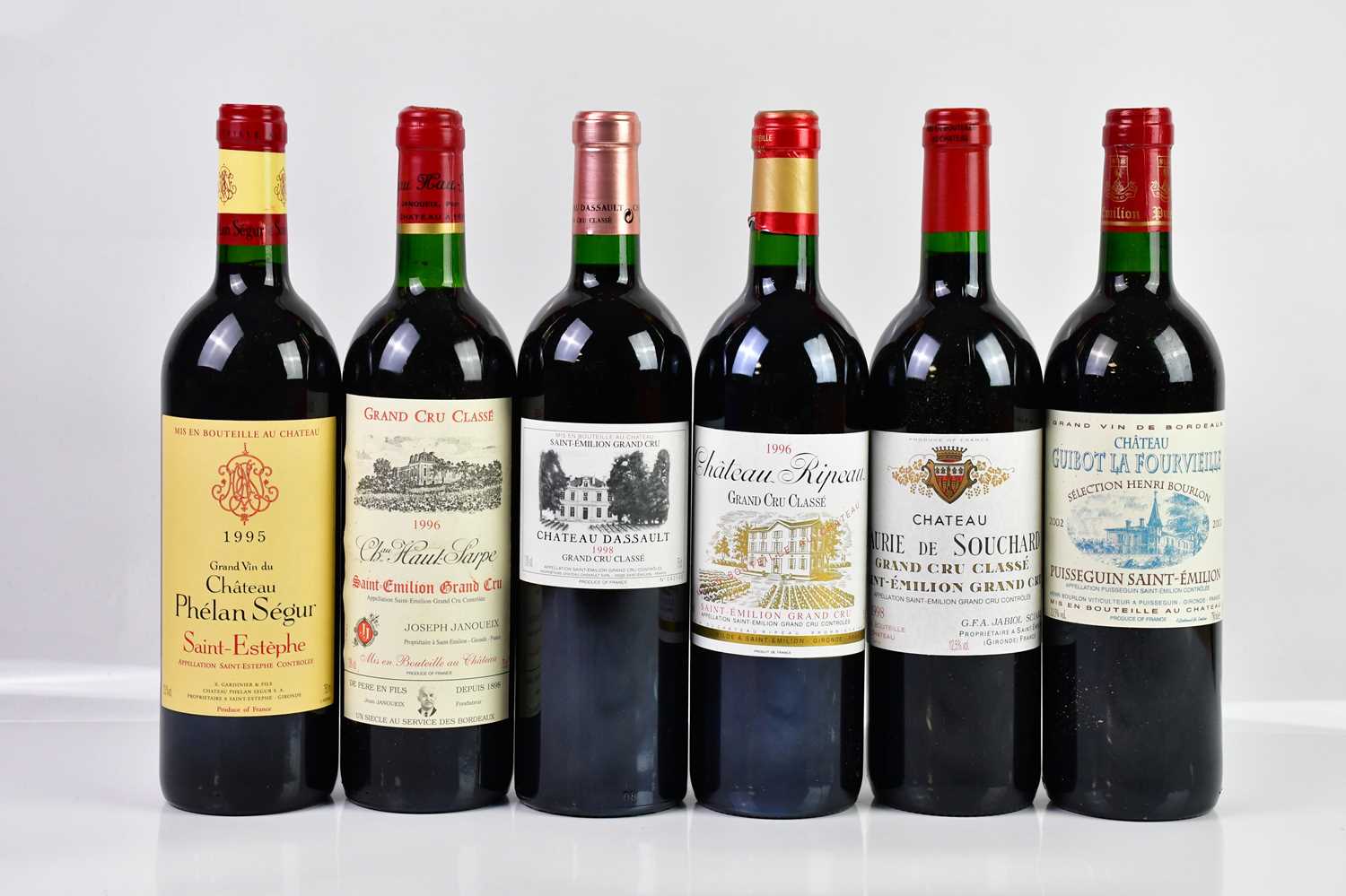 RED WINE; six bottles of mixed claret, including a bottle of Château Phélan Ségur Saint Estèphe