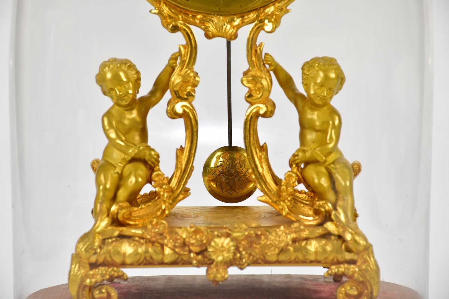 A late 19th century ormolu mantel clock, the oval dial set with Roman numerals on scrolling sabre - Image 3 of 5