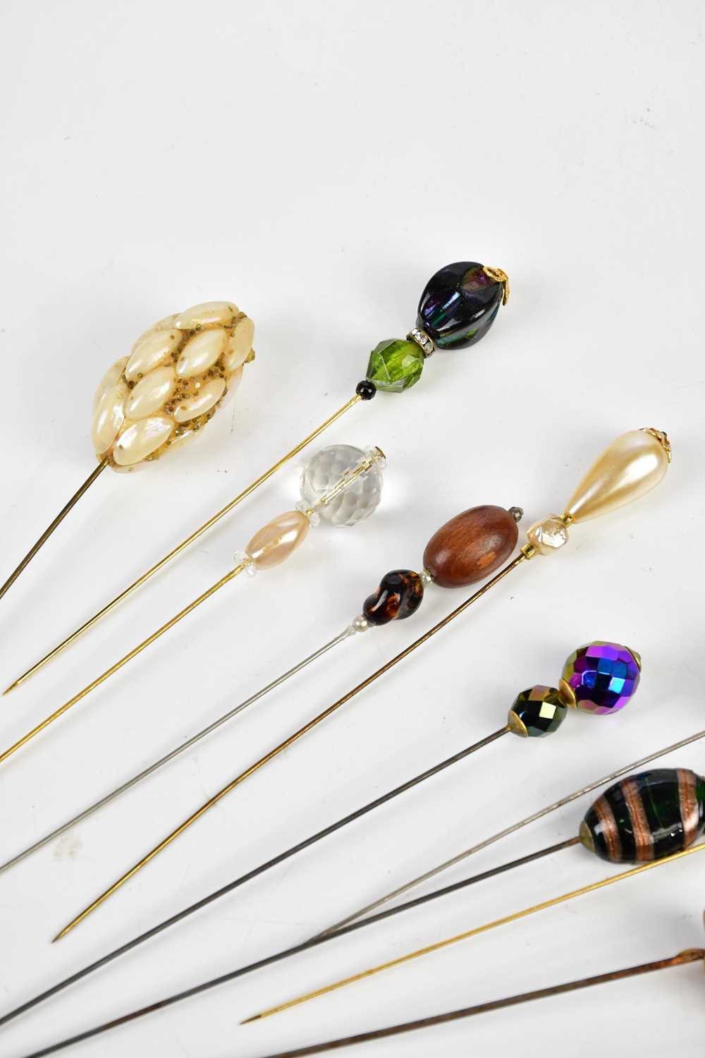 A good collection of hat pins, approximately twenty-five, including glass topped examples. - Image 2 of 4