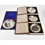 JOHN PINCHES; three limited edition Elizabeth II hallmarked silver plates, with etched detail '