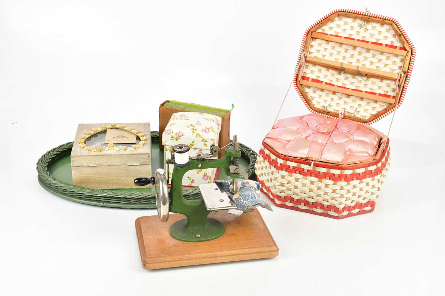 GRAIN; a miniature tabletop sewing machine with part original box, sewing basket and assorted sewing