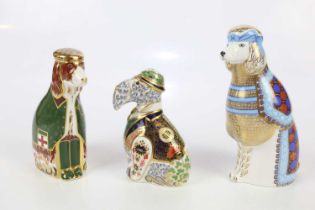 ROYAL CROWN DERBY; three dog paperweights, comprising Irish Blue Kerry 55/1000, English Spaniel