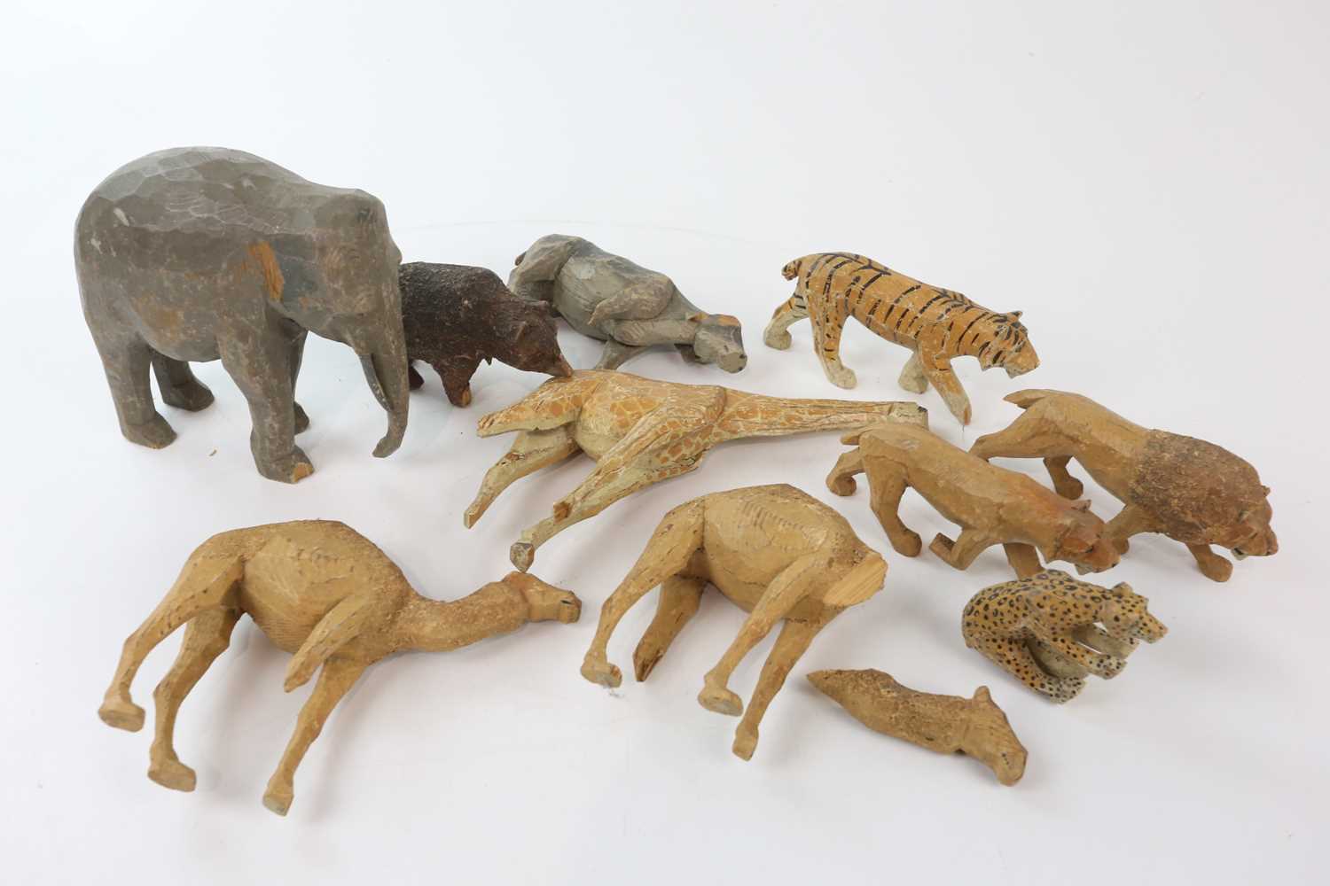 A collection of ten early 20th century carved and painted wood toy animals, elephant height 16cm.
