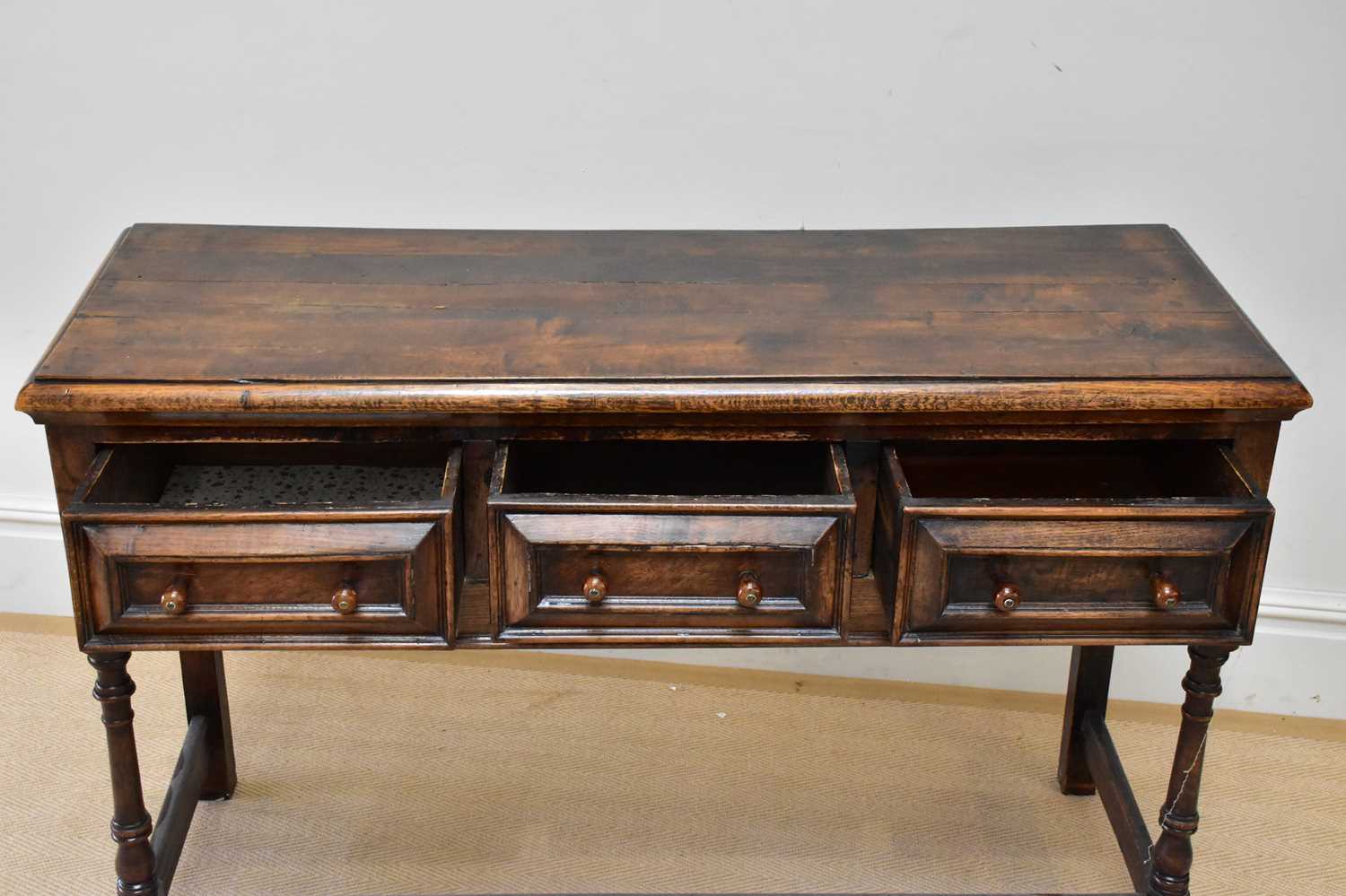 An 18th century style oak dresser base with three drawers, on bun feet, width 133cm, depth 47cm, - Image 3 of 3