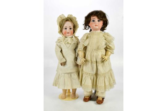 J STEINER, PARIS; a French bisque headed doll with painted eyes and eyebrows, and articulated limbs, - Image 1 of 5