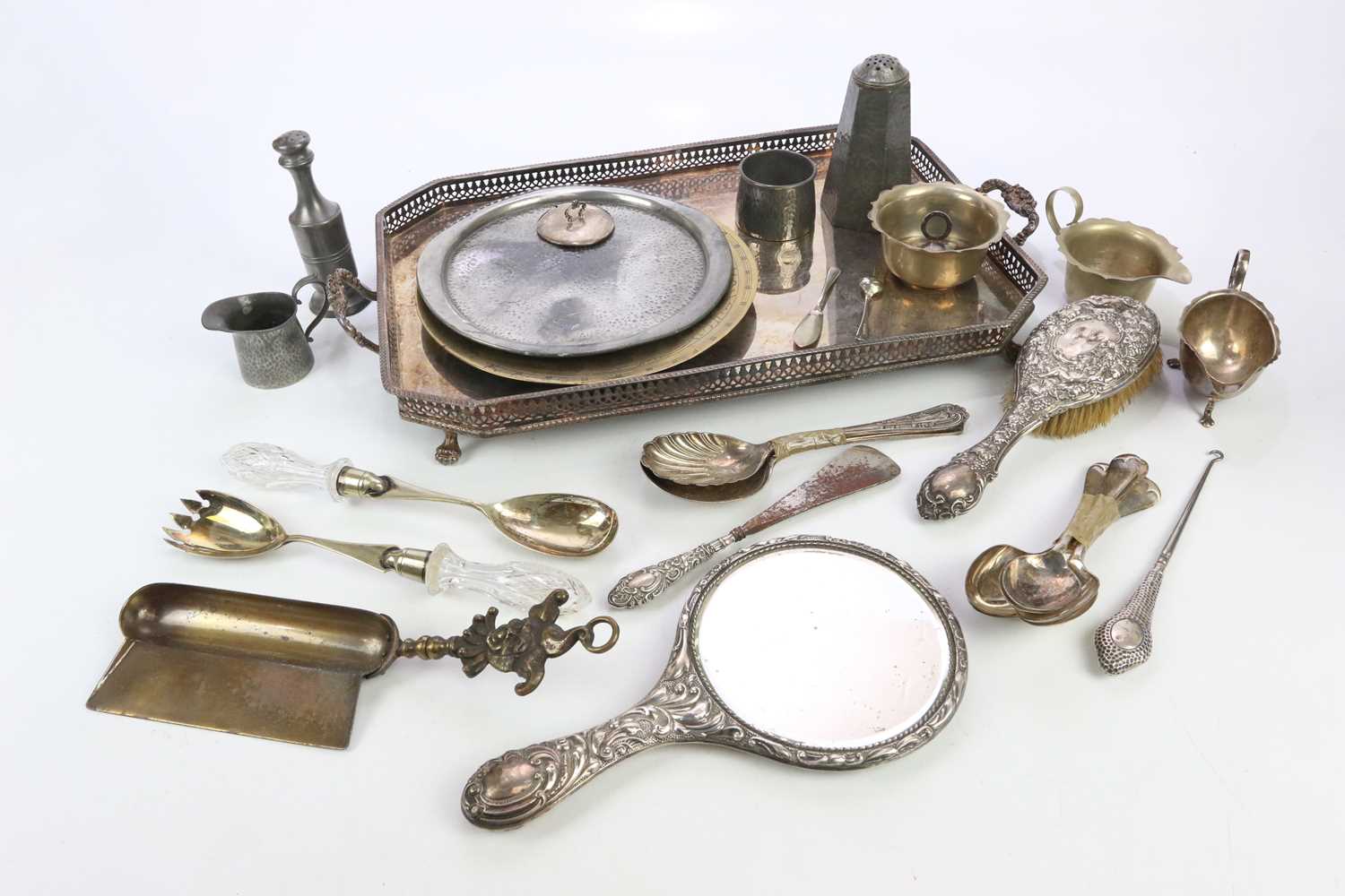 A collection of electroplated items including a twin handled tray, cutlery, sauceboat, together with