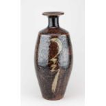 † DAVID LEACH (1911-2005) for Lowerdown Pottery; a tall stoneware bottle covered in tenmoku breaking