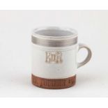 † ROBIN WELCH (1936-2019); a stoneware Silver Jubilee commemorative mug, impressed mark, height 9cm,