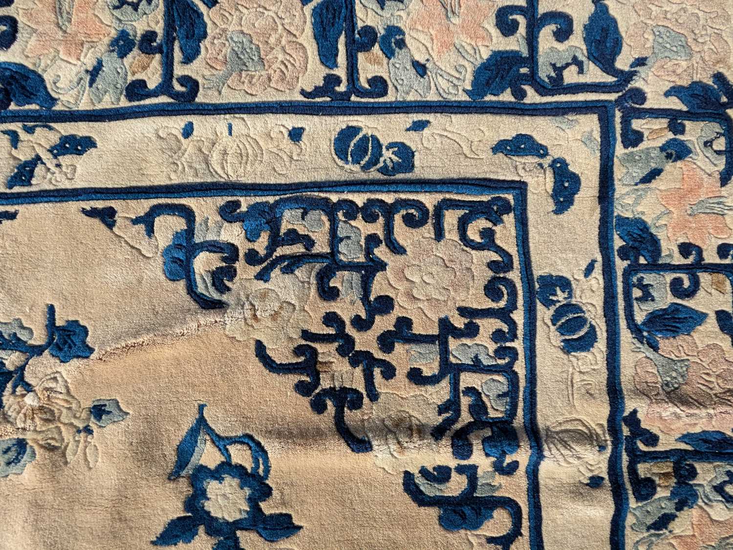 A large Chinese Superwash floor rug, with scrolling floral detail on a blue and ivory ground. - Image 3 of 3