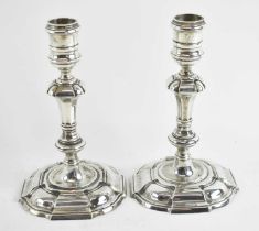 C. J. VANDER LTD; a pair of Elizabeth II hallmarked silver candlesticks, London 1968, height 17cm,