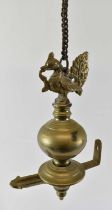 An Indian brass hanging oil lamp with bird relief decoration to the top, approx height 48cm.