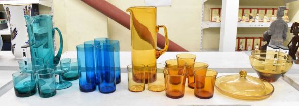 A group of art glass including an amber coloured jug and five matching beakers, also two other