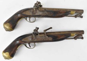 A pair of 19th century flintlock pistols. Condition Report: No cracks or losses to the body of the