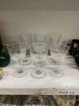 A set of nine Victorian etched glass sherry glasses, height 12cm.