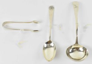 A George III hallmarked silver soup ladle, London 1784, together with a George V hallmarked silver