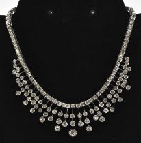 A white metal Art Deco style frilled diamond set necklace, the largest stone approx 0.5ct,