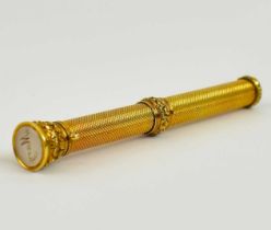 S. MORDAN & CO; an early 20th century yellow metal propelling fountain pen, length 9.5cm.