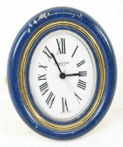 CARTIER; a gilt metal and lapis lazuli effect travelling easel back clock, the white enamel oval