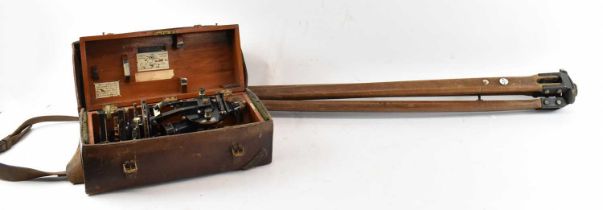 E. R. WATTS & SONS; an early 20th century theodolite, in original wooden case and leather protective