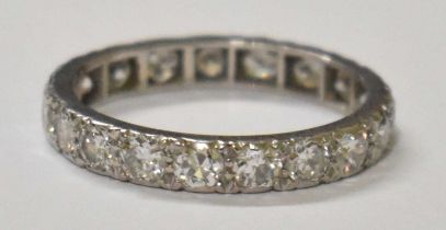 A white metal diamond set full eternity ring, diamonds totalling approx 1.5ct, size N, weight 2.8g.