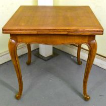 An early 20th century French oak draw-leaf dining table, dimensions of top when not extended 80 x