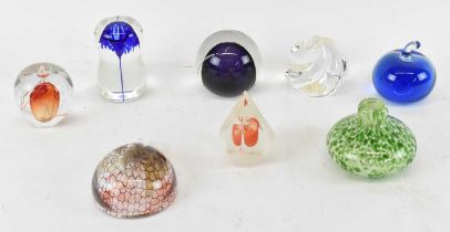 A group of eight Bohemian style art glass paperweights.