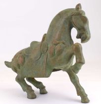 An early 20th century bronzed with patina Chinese Tang style half rearing caparisoned horse,