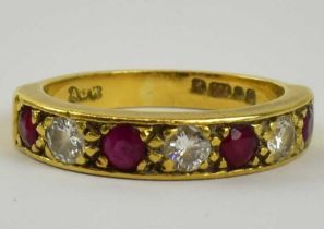 An 18ct yellow gold diamond and ruby half eternity ring set with four small rubies and three small