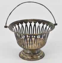 HENRY WILLIAMSON LTD; an Edward VII hallmarked silver pierced basket, with swing handle,