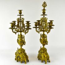 A pair of ornate brass five branch candelabra, one lacking cover, height approx 62cm.