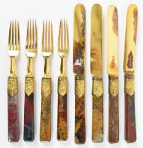 A set of four gilt plated forks, with agate handles and matching set of four gilt plated and agate