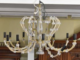 A modern twelve branch cut glass chandelier, height 59cm.