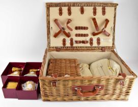 A modern wicker picnic basket enclosing four boxed Historic Royal Palaces commemorative vases, '