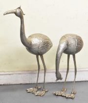 A pair of contemporary silvered models of flamingos, height to top of tallest 90cm.