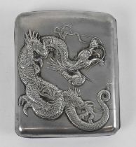 KUHN & KOMOR; a Chinese white metal cigarette case with dragon decoration to the front, 8.5 x 7cm,