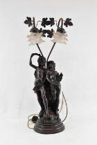 A spelter figural table lamp, with two glass shades, height approx 77cm.